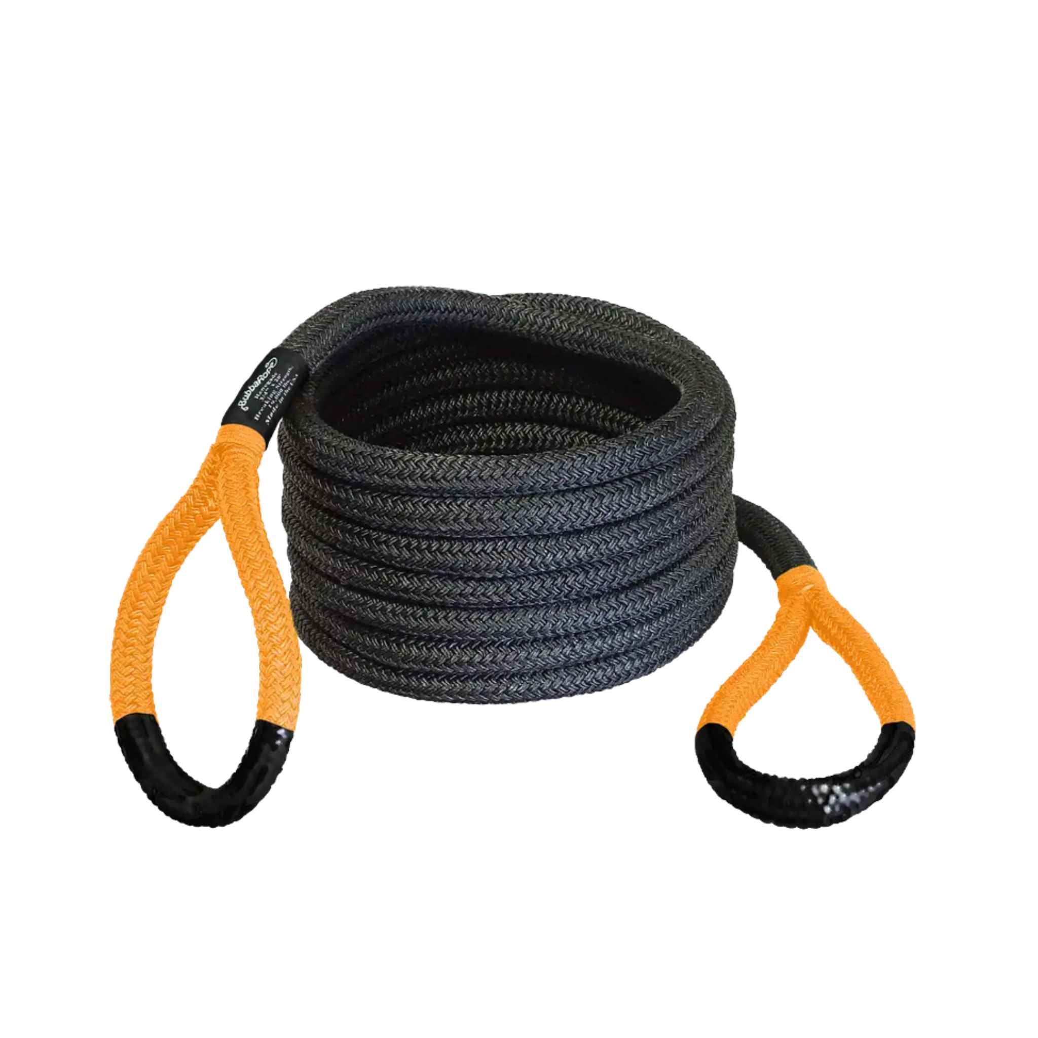 Coiled black rope with orange handles on a white background