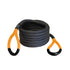 Coiled black rope with orange handles on a white background